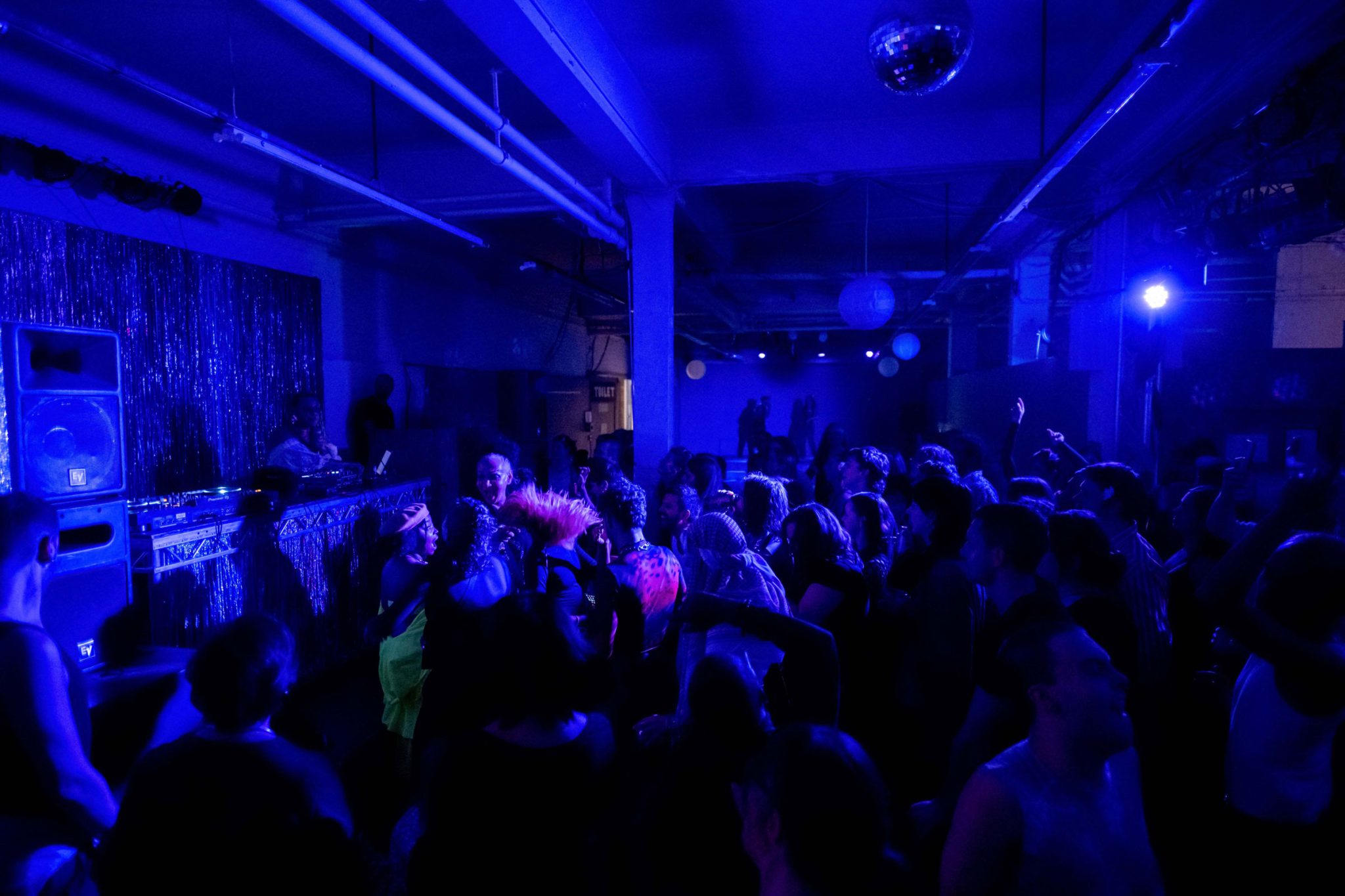 A blue lit club scene